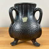 Camark Art Pottery Black Gun Metal Glaze Dimpled Surface Three Legged Handled Vase