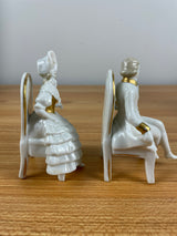 Capodimonte Figurine Colonial Man & Woman Sitting In Chairs Reading Gold Accents