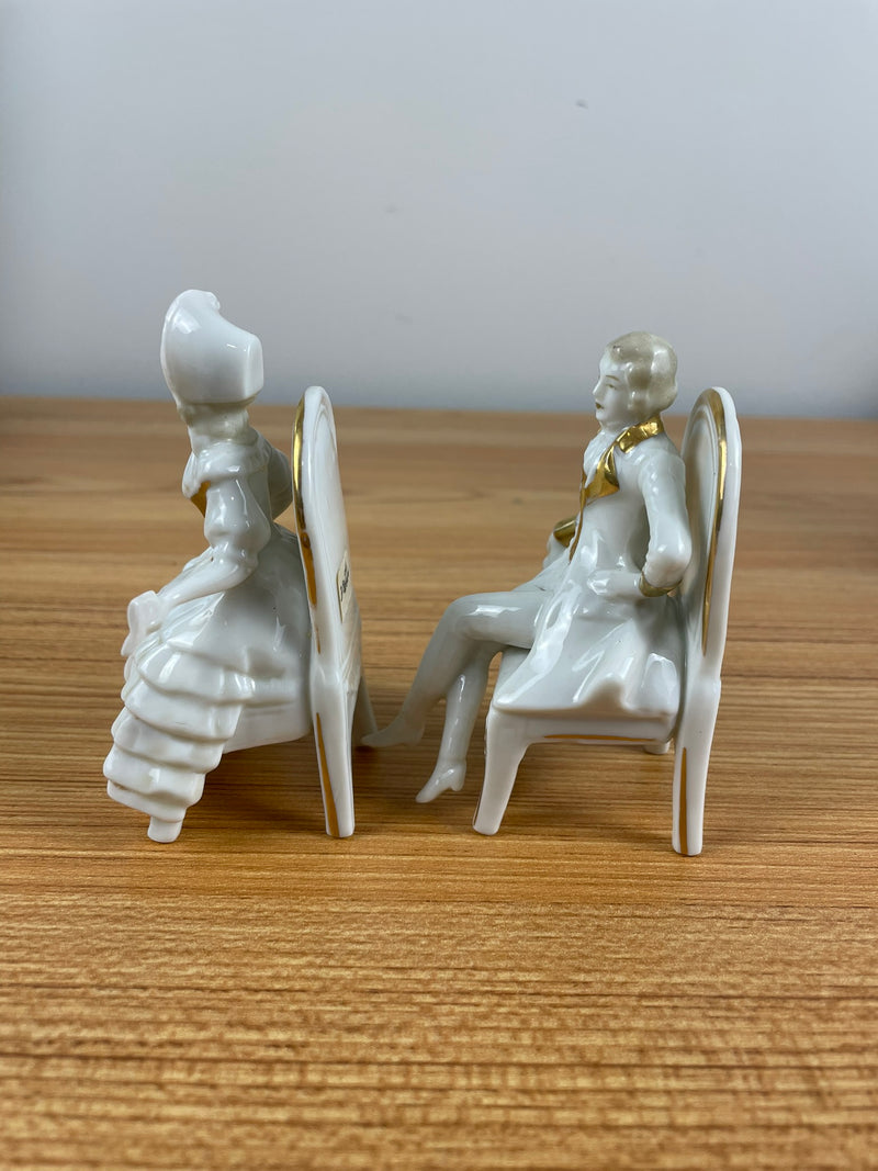 Capodimonte Figurine Colonial Man & Woman Sitting In Chairs Reading Gold Accents