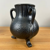 Camark Art Pottery Black Gun Metal Glaze Dimpled Surface Three Legged Handled Vase